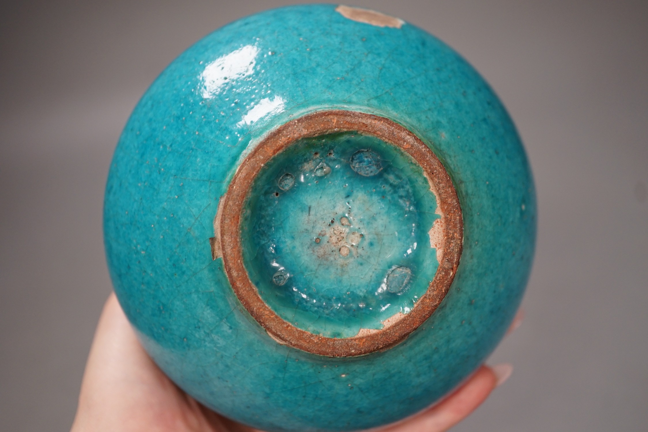 A Kashan style turquoise glazed vase. 10cm tall